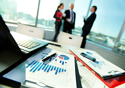 business men with business report on table